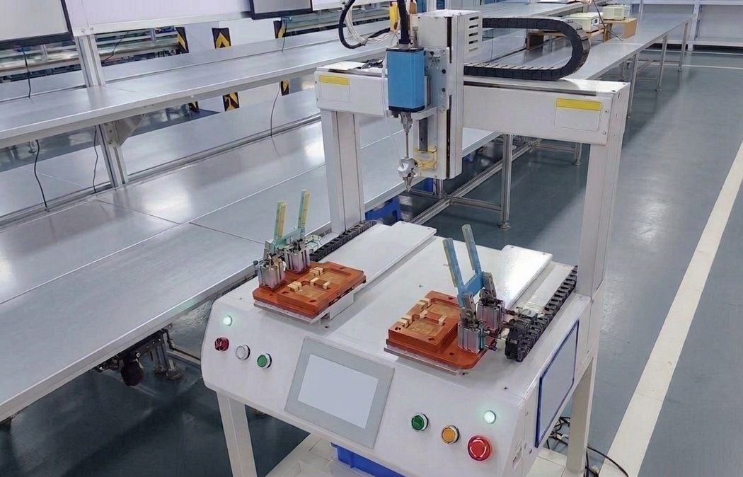 Gantry dispensing robot at an assembly station